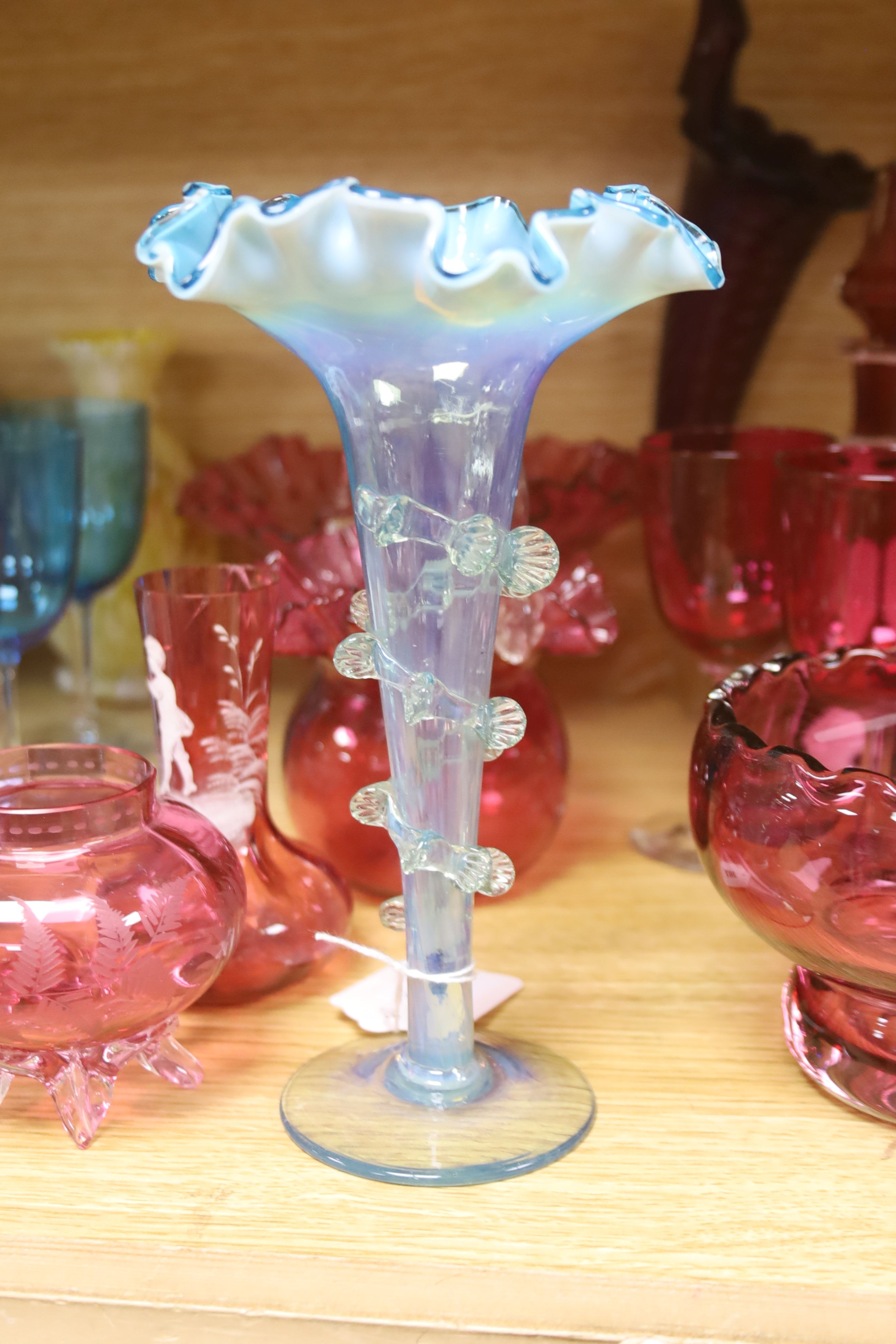 An assortment of 19th century and later coloured glassware including cranberry, Bohemian, Venetian etc.